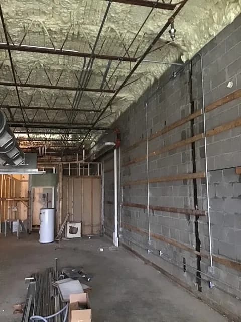 Utility room with conduit, HVAC ductwork, and water heater roughed in